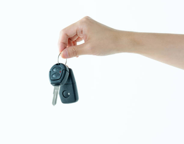 istock Woman hand holding a car key 1141253347