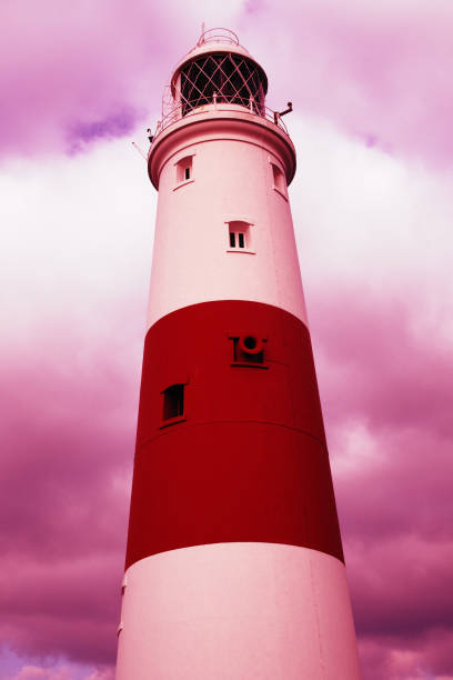 Lighthouse with fair weather Lighthouse at Portland Bill, The Isle of Portland, Dorset, UK uncompromising stock pictures, royalty-free photos & images