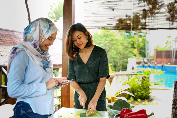 istock Friends preparing food for celebration 1141253543