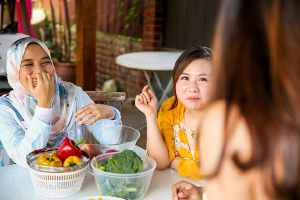 istock Friends preparing food for celebration 1141253913