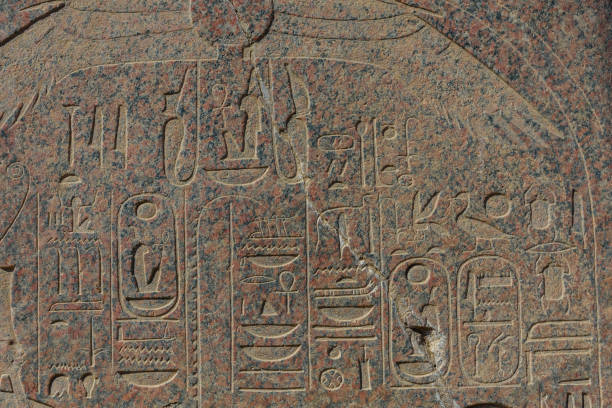 istock Egyptian ancient hieroglyphs on the stone wall 1141254284
