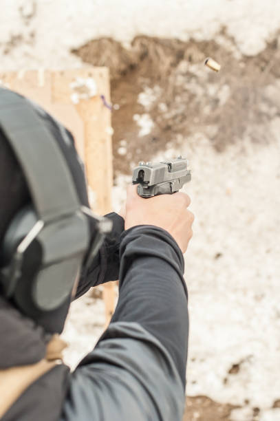 istock Shooting on target in shooting range. Back close-up detail view 1141254375