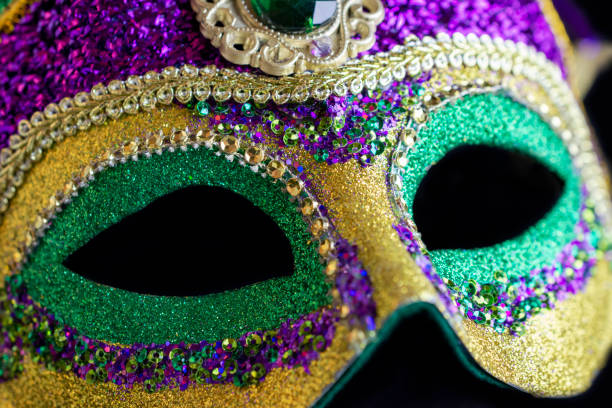 istock Jester mask up close against black background. 1141254651