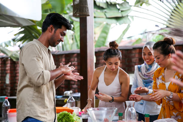 istock Friends preparing food for celebration 1141255318