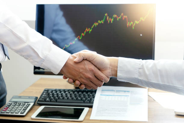 istock businessman shake hand at the office table 1141255386