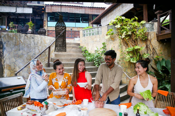 istock Friends preparing food for celebration 1141255873