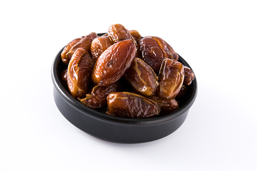 Sweet dry dates isolated on white background