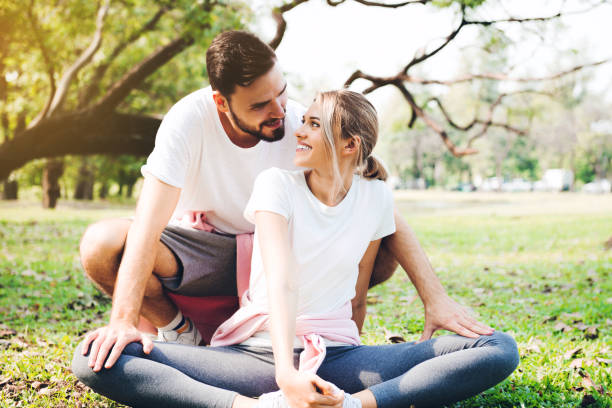 istock Young couple stretching at the park 1141257531