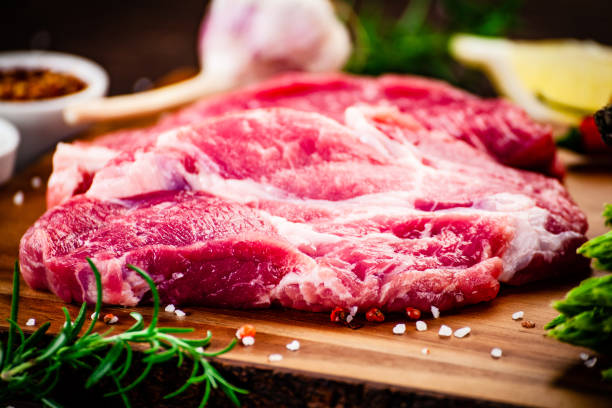istock Fresh raw pork on stone cutting board 1141259741