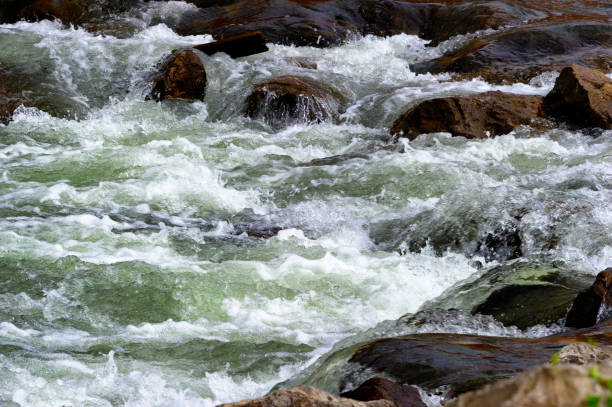 istock Close up of river water cascading over rocks 1141262853