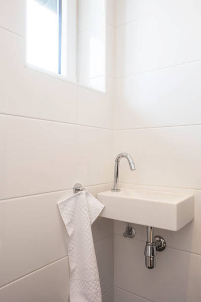 istock Toilet sink interior white bathroom, faucet with white wall 1141263611
