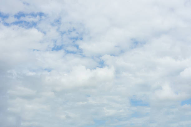 istock Beautiful white fluffy clouds in the blue sky day, cloud day. It best for background, abstract or blur. 1141263908
