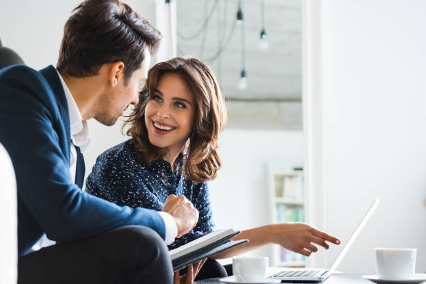 istock Business professionals discussing over laptop 1141264306