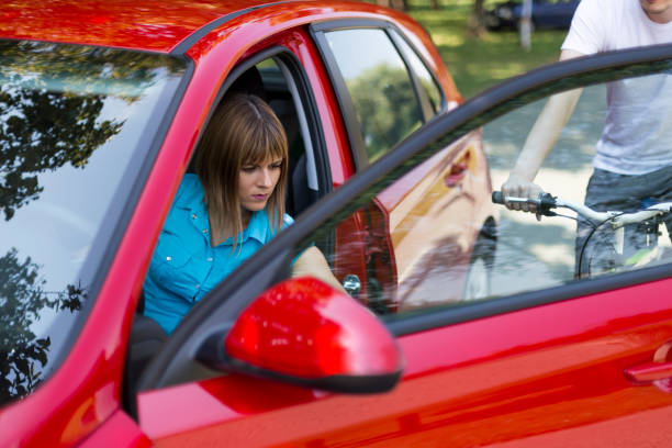 istock Dangerous situation with cyclist and car 1141267541