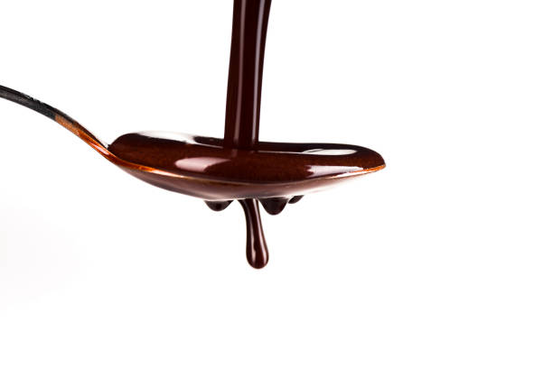 istock Spoonful of the chocolate on the white background 1141271849