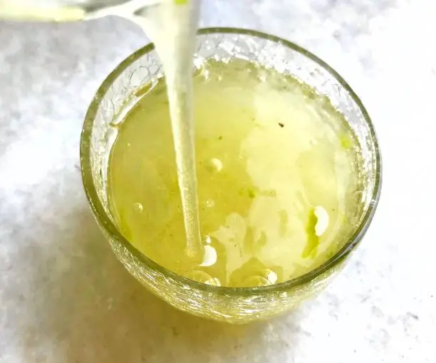 A glass bowl of aloe vera leaf gel