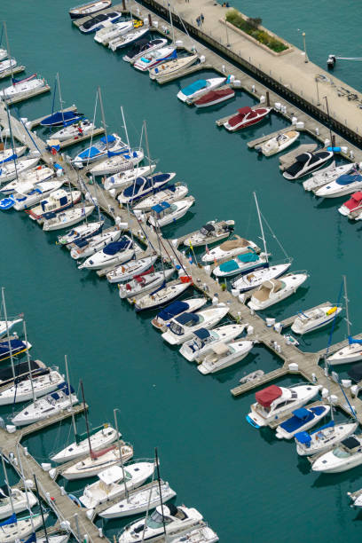 Downtown Chicago skyline, aerial / elevated view with Grant Park in the distance, and with Burnham Harbor with yachts and other boats in the foreground.