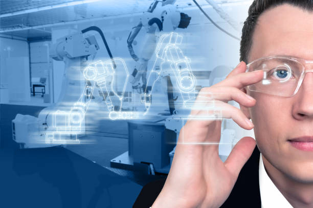 istock The engineer uses a glasses with augmented reality to control robots in a smart factory. 1141280166
