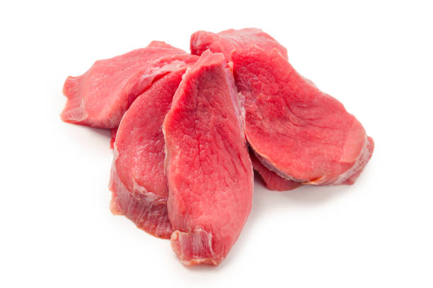 Veal pieces raw isolated on white background.