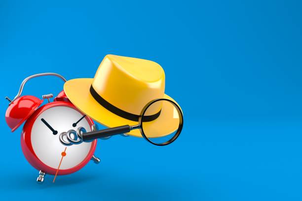 istock Detective hat and magnifying glass with alarm clock 1141281528