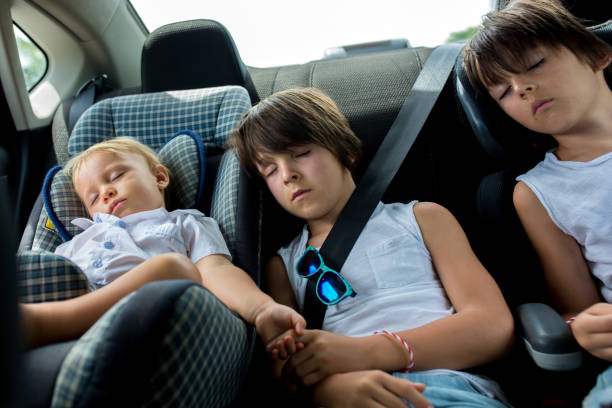 istock Children, sleeping in carseats while traveling 1141283191