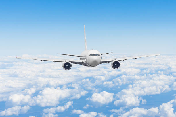istock Aircraft fly high in the sky above the summer clouds. 1141283373