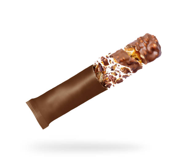 istock Chocolate bar with nuts falls from the packaging, isolated on a white background 1141285446