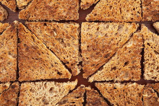 Top view of triangle shaped brown bread toasts