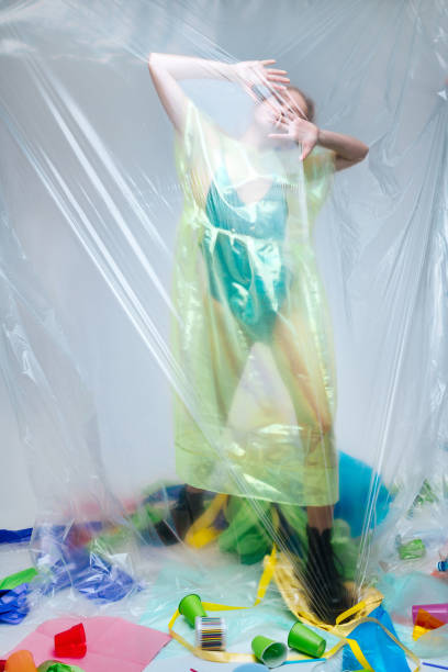 istock Model wearing green non-natural clothing posing for ecology protest 1141288487