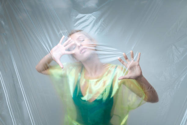 istock Young model hardly breathing standing near plastic sheet 1141288488