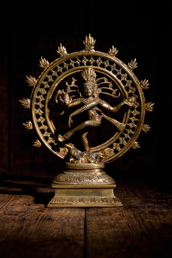 Statue of indian hindu god Shiva Nataraja - Lord of Dance on wooden background
