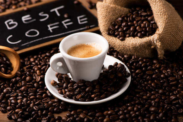 istock Cup of coffee surrounded by coffee beans 1141290145