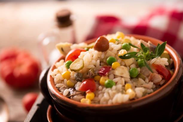 istock Rice salad in a bowl on wooded table 1141290953