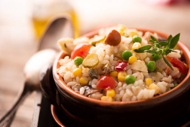 istock Rice salad in a bowl on wooded table 1141292031