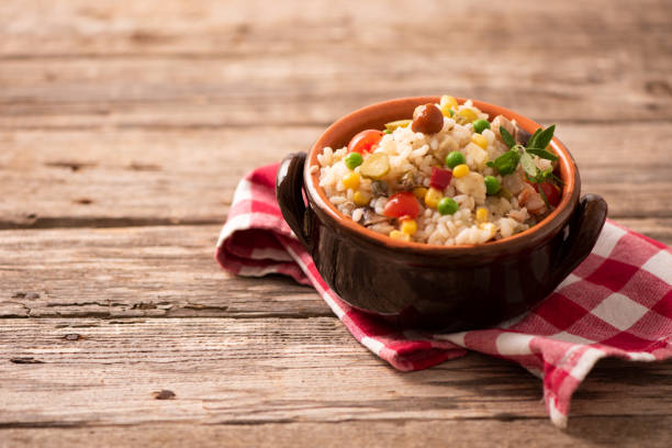 istock Rice salad in a bowl on wooded table 1141292080