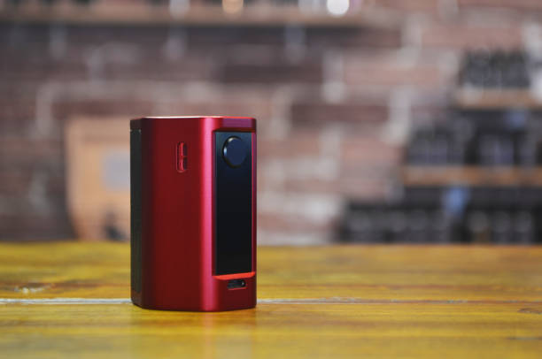 istock Electronic cigarette on a background of vape shop. 1141292150