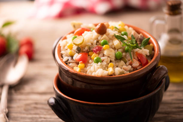 istock Rice salad in a bowl on wooded table 1141292723