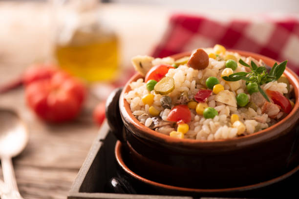 istock Rice salad in a bowl on wooded table 1141292790