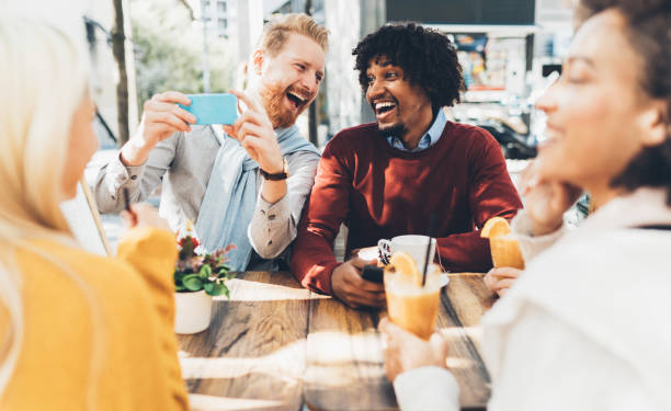istock Multi-ethnic group of friends at cafe 1141293555