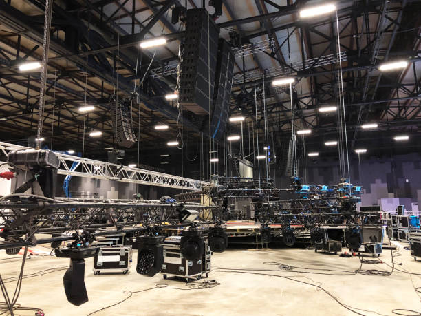 Installation of professional sound, light, video and stage equipment for a concert. Lifting of line array speakers. stock photo