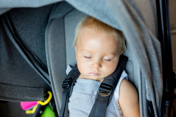 istock Healthy Baby boy is sleeping in stroller 1141293800