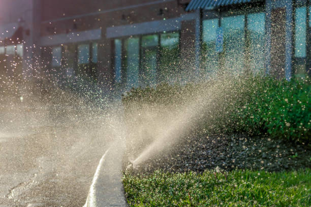 Water spraying from sprinkler system  in business park