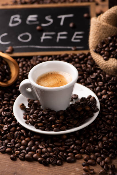 istock Cup of coffee surrounded by coffee beans 1141294053