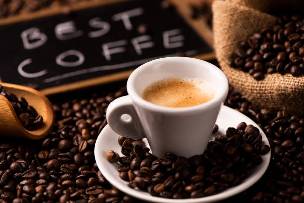 istock Cup of coffee surrounded by coffee beans 1141294156