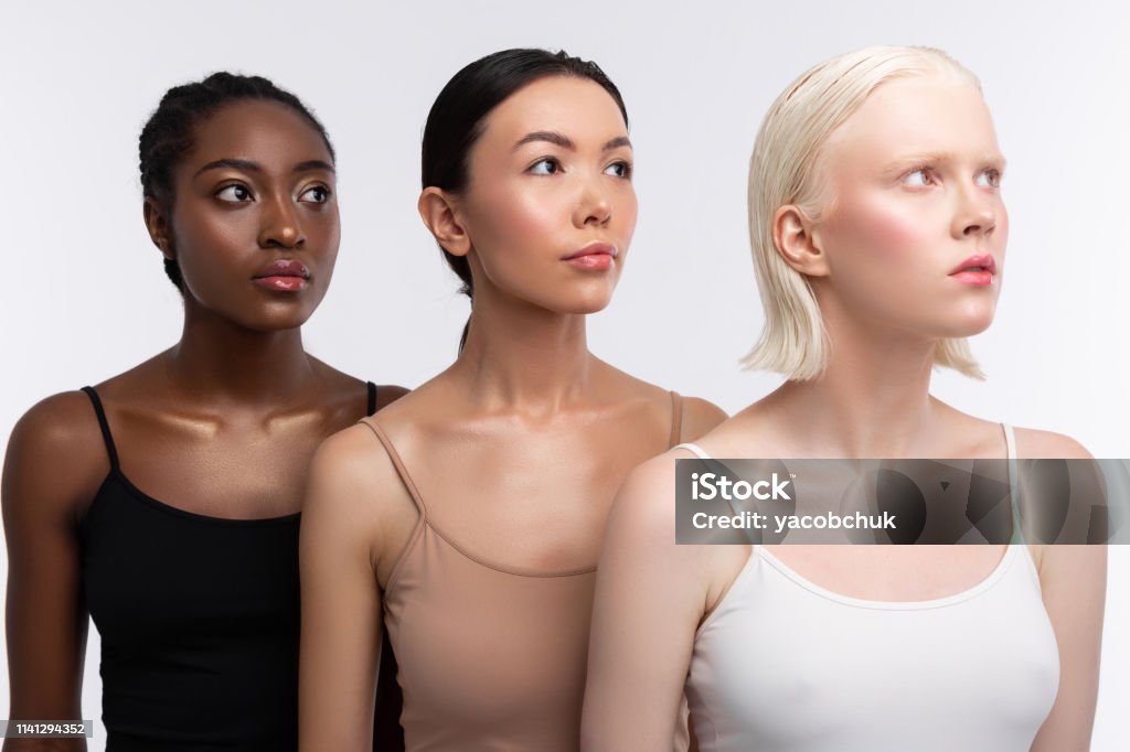 Three Women With Different Skin Color Wearing Camisoles Stock