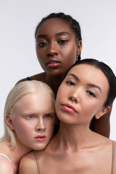 istock Three models working for international magazine posing together 1141294376