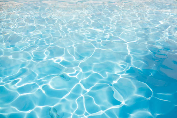 Hotel outdoors swimming pool with sunny reflections
