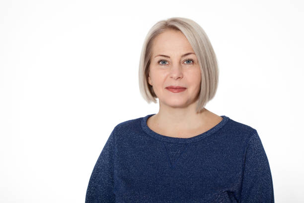 istock Attractive middle aged woman with folded arms on white background 1141299083