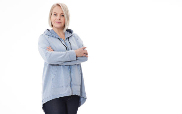 Attractive middle aged woman with folded arms on white background