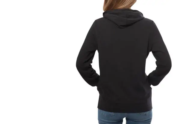 Photo of young girl in black sweatshirt, black hoodies rear view isolated on white background.